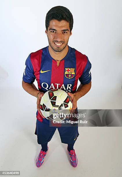 Luis Suarez of Barcelona poses during a portrait session at the Ciutat Esportiva on August 15, 2014 in Barcelona, Spain.