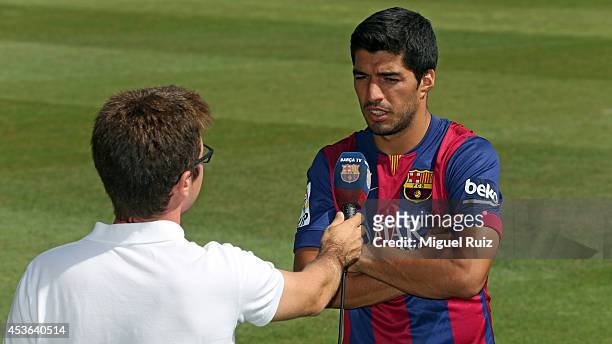Luis Suarez of Barcelona is interviewed during a training session at the Ciutat Esportiva on August 15, 2014 in Barcelona, Spain.
