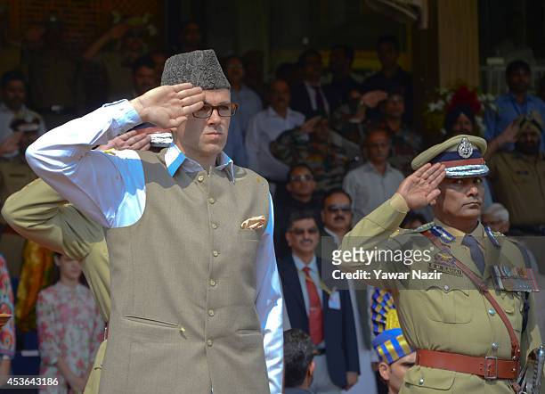 Chief Minister of Jammu and Kashmir Omar Abdullah salutes during India's Independence Day celebrations on August 15, 2014 in Srinagar, the summer...