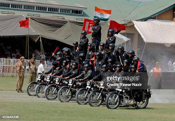 Daredevils from Jammu and Kashmir Police perform stunts on their motorcycles during India's Independence Day celebrations on August 15, 2014 in...