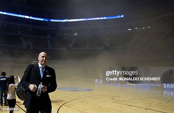 An NBA staffer leaves smoke covered Arena Ciudad de Mexico in Mexico City on December 4, 2013. NBA stars were evacuated from a Mexico City arena...