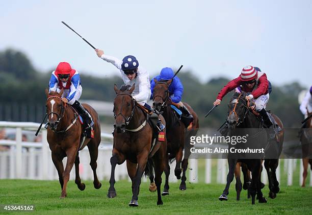 Shane Kelly riding Bronze Maquette win The Bathwick Tyres St Hugh's Stakes at Newbury racecourse on August 15, 2014 in Newbury, England.