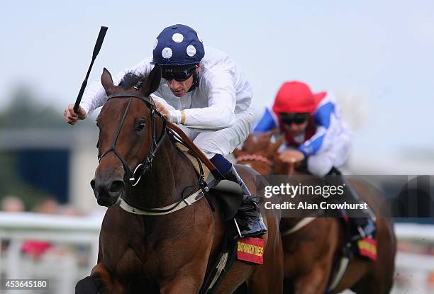 Shane Kelly riding Bronze Maquette win The Bathwick Tyres St Hugh's Stakes at Newbury racecourse on August 15, 2014 in Newbury, England.