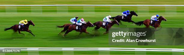 Shane Kelly riding Blue Waltz win The Al Basti Equiworld EBF Stallions Maiden Filie' Stakes at Newbury racecourse on August 15, 2014 in Newbury,...