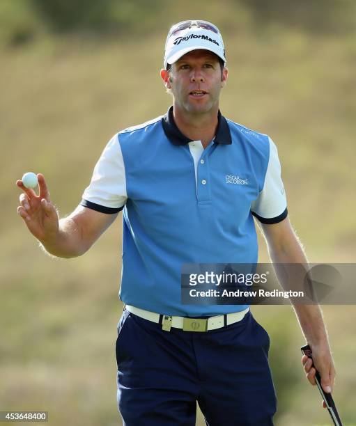 Bradley Dredge of Wales waves to the crowd on the tenth hole during the second round of the Made In Denmark at Himmerland Golf & Spa Resort on August...