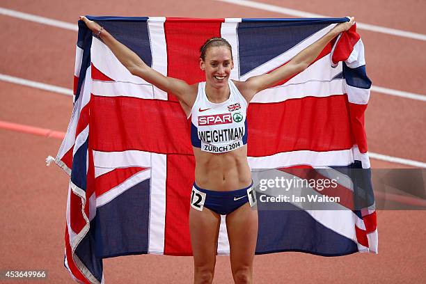 Bronze medalist Laura Weightman of Great Britain and Northern Ireland celebrates with a Union Jack after the Women's 1500 metres final during day...