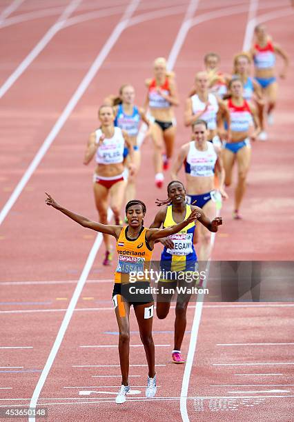 Sifan Hassan of the Netherlands celebrates as she crosses the line to win gold ahead of Adeba Aregawi of Sweden and Laura Weightman of Great Britain...