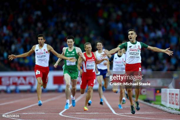 Adam Kszczot of Poland celebrates winning gold ahead of Artur Kuciapski of Poland and Mark English of Ireland in the Men's 800 metres final during...