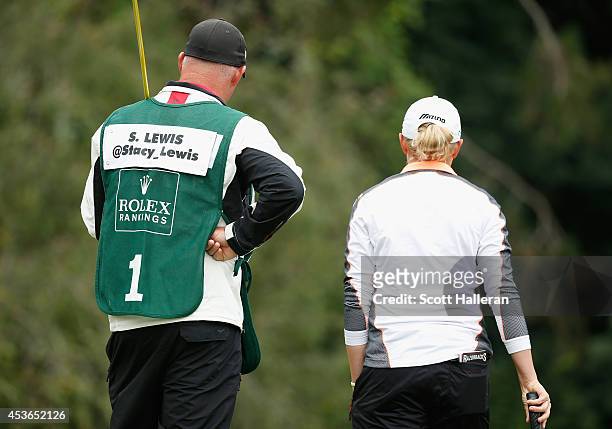 Stacy Lewis waits on the second green with her caddie Travis Wilson during the second round of the Wegmans LPGA Championship at Monroe Golf Club on...