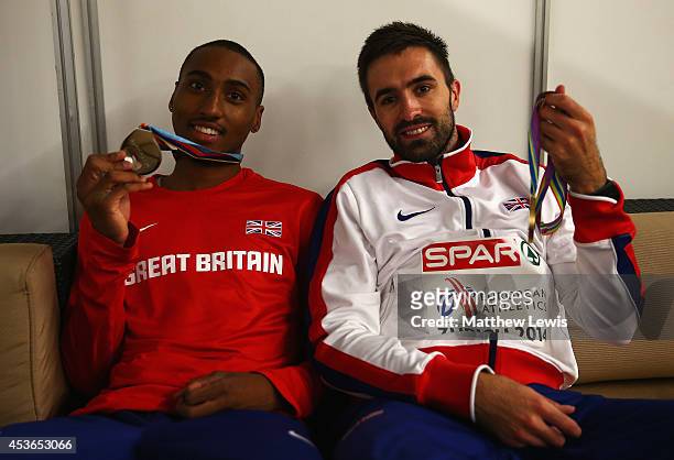 Matthew Hudson-Smith and Martyn Rooney of Great Britain look on in the medal ceremony room, after winning Silver and Gold respectfully in the Mens...