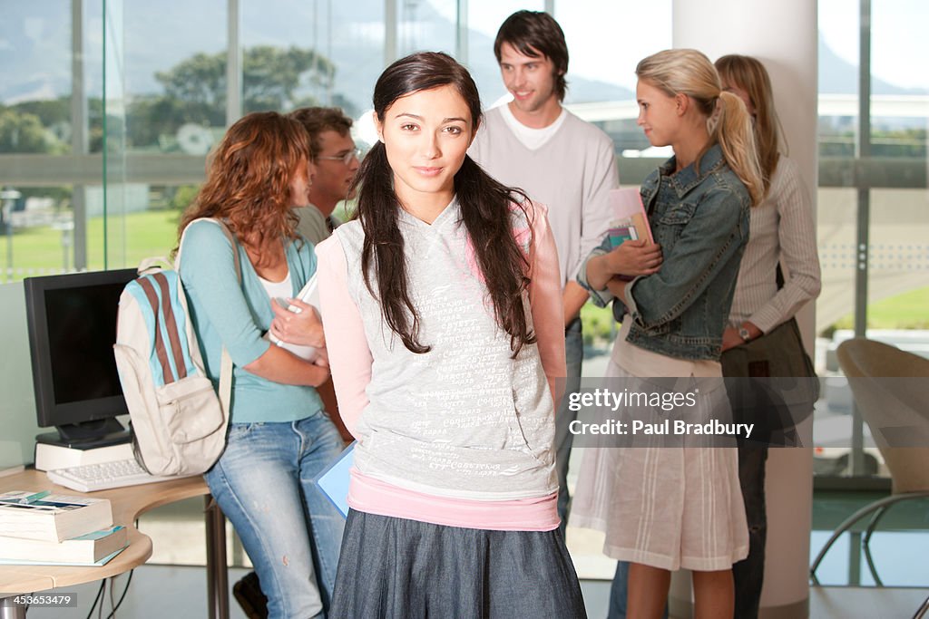 Teenage girl at school with friends 