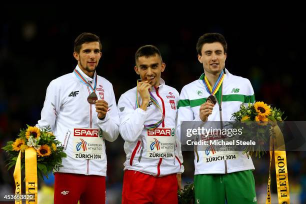 Silver medalist Artur Kuciapski of Poland, gold medalist Adam Kszczot of Poland and bronze medalist Mark English of Ireland stand on the podium...