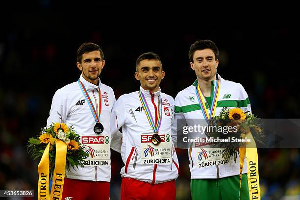 Silver medalist Artur Kuciapski of Poland, gold medalist Adam Kszczot of Poland and bronze medalist Mark English of Ireland stand on the podium...