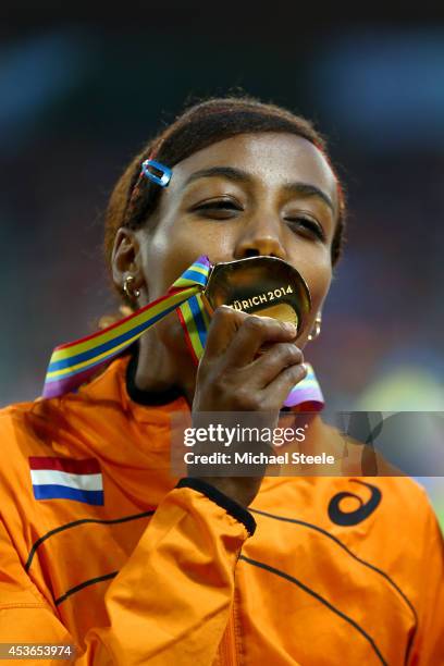 Gold medalist Sifan Hassan of the Netherlands kisses her medal on the podium during the medal ceremony for the Women's 1500 metres final during day...