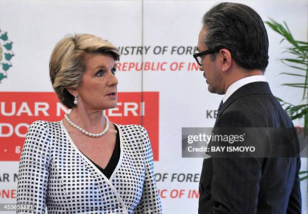 Indonesia and Australia foreign ministers, Marty Natalegawa and Julie Bishop chat before their meeting in Jakarta on December 5, 2013. Bishop arrived...