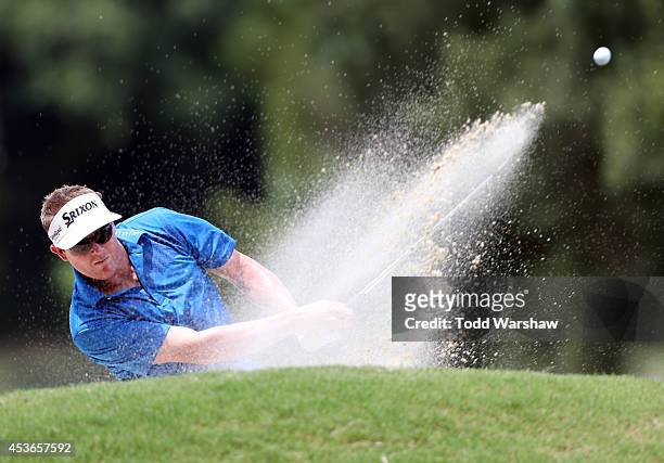 Charlie Beljan plays a shot out of the bunker on the second hole during the second round of the Wyndham Championship at Sedgefield Country Club on...