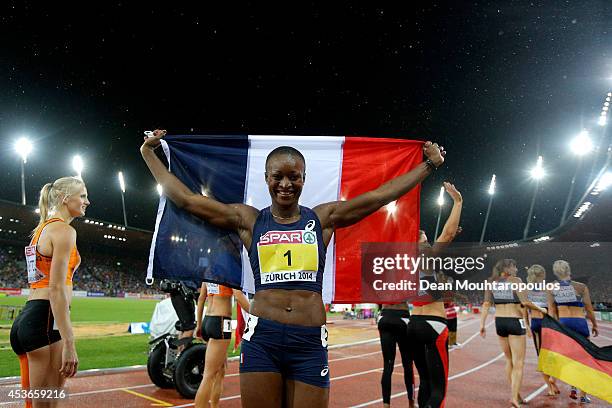 Antoinette Nana Djimou of France celebrates with the French national flag as she win gold in the Women's Heptathlon during day four of the 22nd...