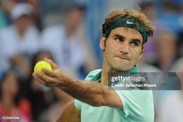 Roger Federer of Switzerland serves against Andy Murray of Great Britian during a match on day 7 of the Western & Southern Open at the Linder Family...