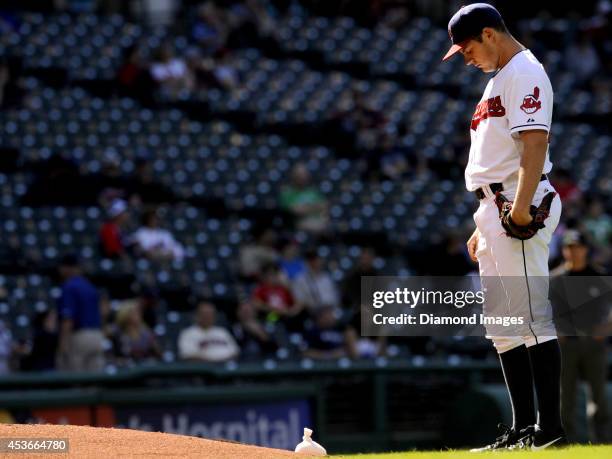 Pitcher Trevor Bauer of the Cleveland Indians stands behind the pitcher's mound prior to the sixth inning of a game against the Arizona Diamondbacks...