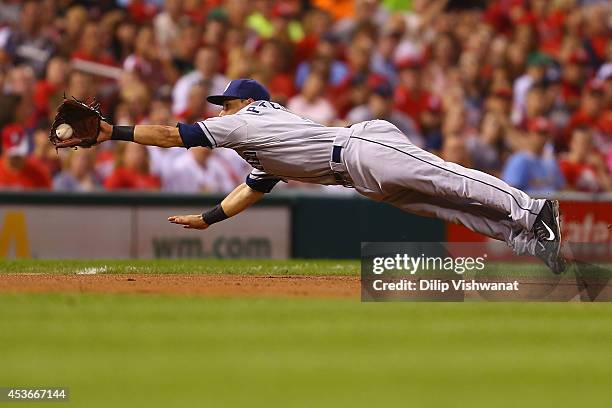 Jace Peterson of the San Diego Padres fields a ground ball against the St. Louis Cardinals in the fifth inning at Busch Stadium on August 15, 2014 in...