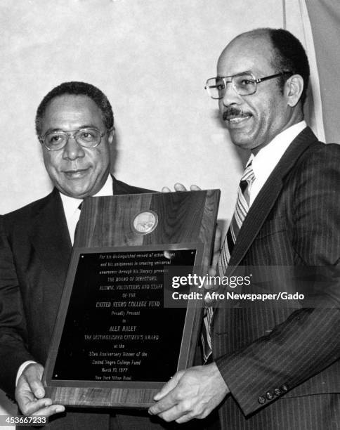 Author Alex Haley receives an award from the United Negro College Fund, 1977.