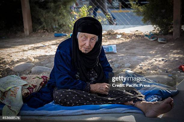 An old Muslim woman sheltered in the Mar Tshmony church. 500 Christian families have been sheltered at Mar Tshmony church, after an unprecedented...