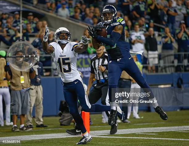 Cornerback Tharold Simon of the Seattle Seahawks intercepts a pass in the end zone against Dontrelle Inman of the San Diego Chargers at CenturyLink...