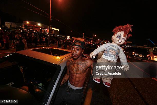 Demonstrators raise gather at West Florissant Avenue to protest the shooting death of Michael Brown by a police officer in Ferguson, Missouri, on...