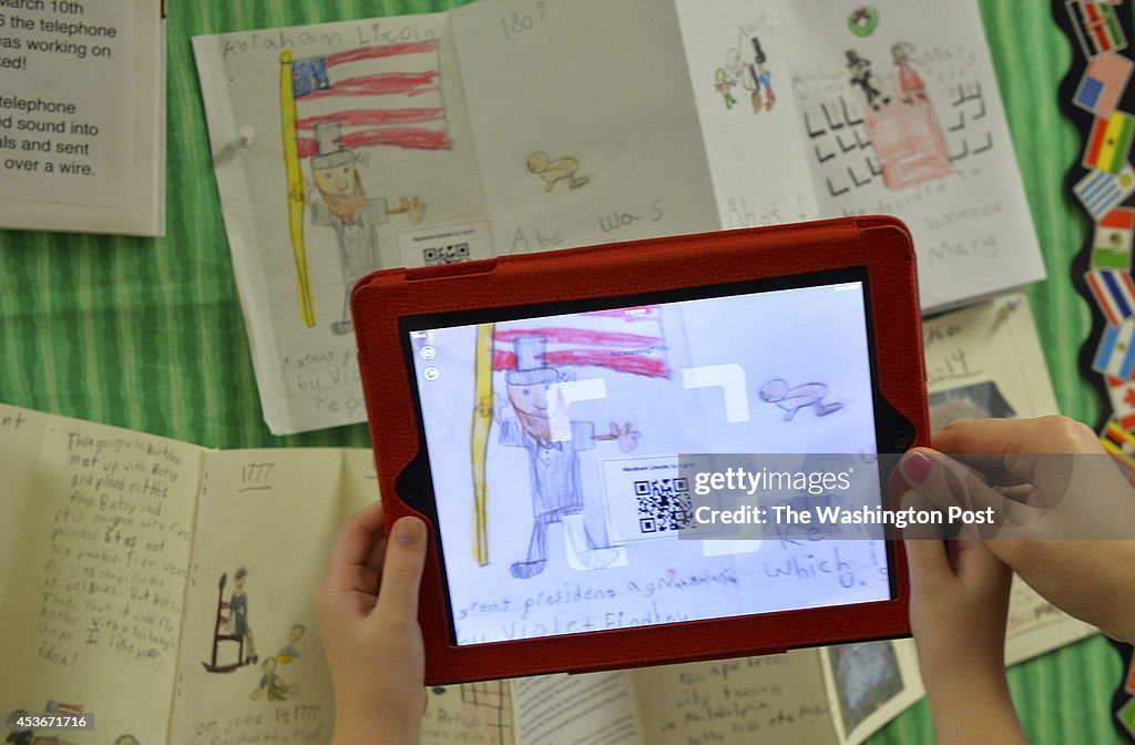 ARLINGTON, VA - MAY 13: Second grader Ingrid Soracco scans her 