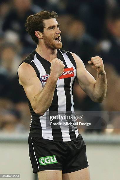 Tyson Goldsack of the Magpies celebrates a goal during the round 21 AFL match between the Collingwood Magpies and the Brisbane Lions at Melbourne...
