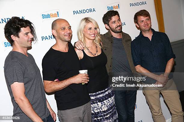 Musicians Kelly Pratt, Michael Lerner, Peter Silberman, and Darby Cicci of The Antlers pose with fans at Pandora Presents The Antlers at StubHub's...