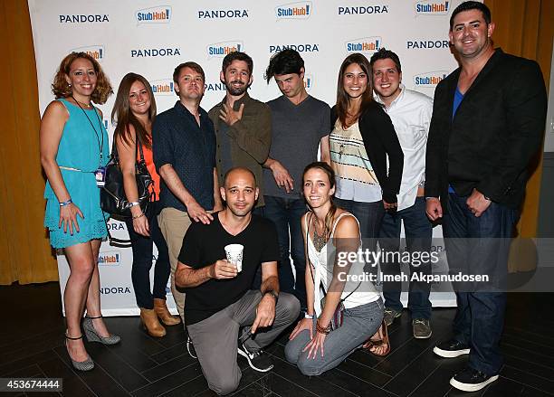 Musicians Kelly Pratt, Michael Lerner, Peter Silberman, and Darby Cicci of The Antlers pose with fans at Pandora Presents The Antlers at StubHub's...