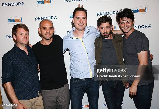 Musicians Kelly Pratt, Michael Lerner, Peter Silberman, and Darby Cicci of The Antlers pose with fans at Pandora Presents The Antlers at StubHub's...