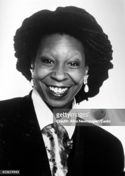 African American comedian and actress Whoopi Goldberg smiles for the camera, 1980.