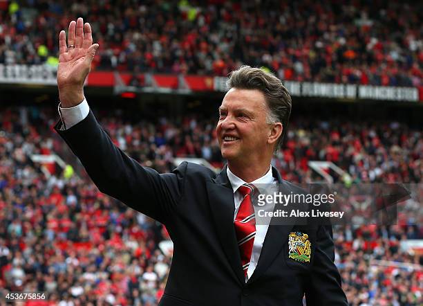 Manchester United Manager Louis van Gaal waves to the crowd prior to the Barclays Premier League match between Manchester United and Swansea City at...