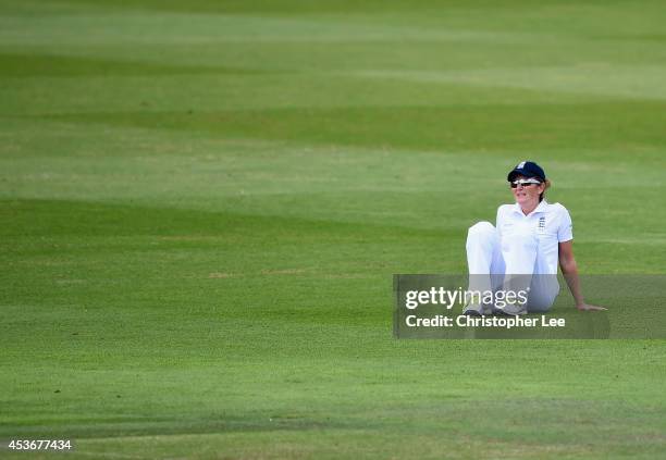 Captain Charlotte Edwards of England looks dejected as a shot races past her during Day Four of the Womens Test match between England and India at...