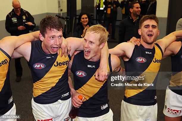 Tigers players celebrate after winning the round 21 AFL match between the Adelaide Crows and the Richmond Tigers at Adelaide Oval on August 16, 2014...