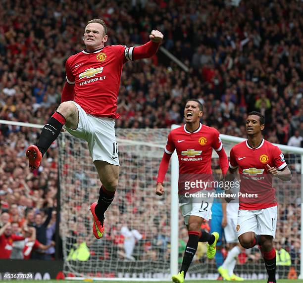Wayne Rooney of Manchester United celebrates scoring their first goal during the Barclays Premier League match between Manchester United and Swansea...