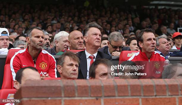 Manager Louis van Gaal and Assistant Manager Ryan Giggs and Assistant coach Albert Stuivenberg of Manchester United watch from the dugout during the...