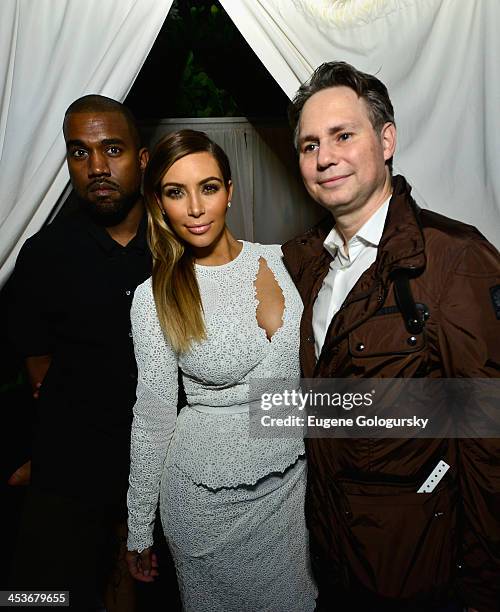 Kanye West, Kim Kardashian, and Jason Binn attend DuJour Magazine's event to honor artist Marc Quinn at Delano South Beach Club on December 4, 2013...