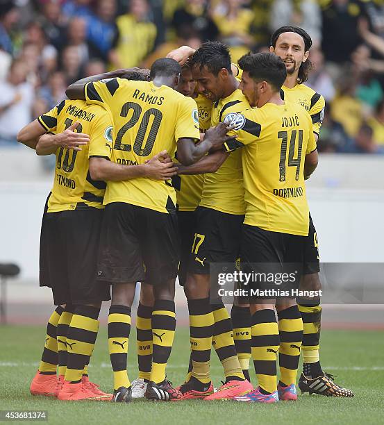 Henrikh Mkhitaryan of Dortmund celebrates with his team-mates after scoring his team's first goal during the DFB Cup first round match between...