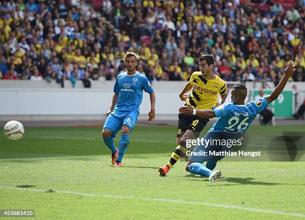 Henrikh Mkhitaryan of Dortmund scores his team's first goal during the DFB Cup first round match between Stuttgarter Kickers and Borussia Dortmund at...