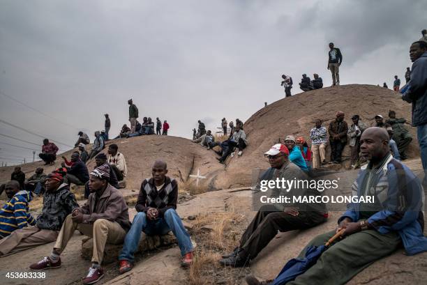 People gather on August 16 on the hill where two years ago miners where gunned down by the South African police during a violent wave of strikes....