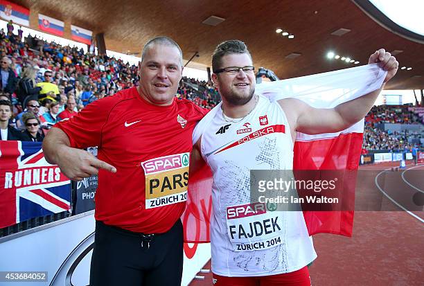 Krisztian Pars of Hungary celebrates as he wins gold alongside silver medalist Pawel Fajdek of Poland in the Men's Hammer final during day five of...