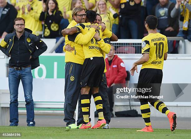 Pierre-Emerick Aubameyang of Dortmund celebrates with his team-mate and head coach Juergen Klopp of Dortmund after scoring his team's secon goal...