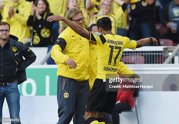 Pierre-Emerick Aubameyang of Dortmund celebrates with his team-mate and head coach Juergen Klopp of Dortmund after scoring his team's secon goal...