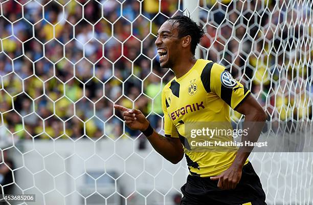 Pierre-Emerick Aubameyang of Dortmund celebrates after scoring his team's third goal during during the DFB Cup first round match between Stuttgarter...