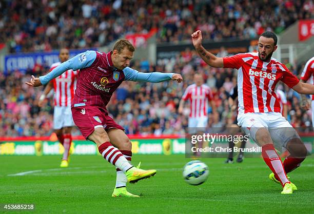 Andreas Weimann of Aston Villa scores the opening goal during the Barclays Premier League match between Stoke City and Aston Villa at Britannia...