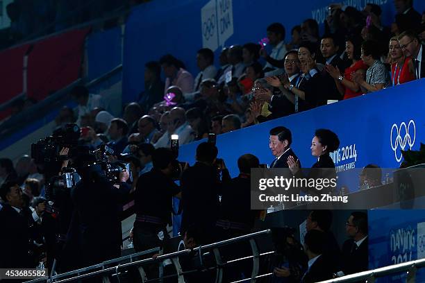 Chinese President Xi Jinping and his wife Peng liyuan attends the opening ceremony for the Nanjing 2014 Summer Youth Olympic Games at the Nanjing...