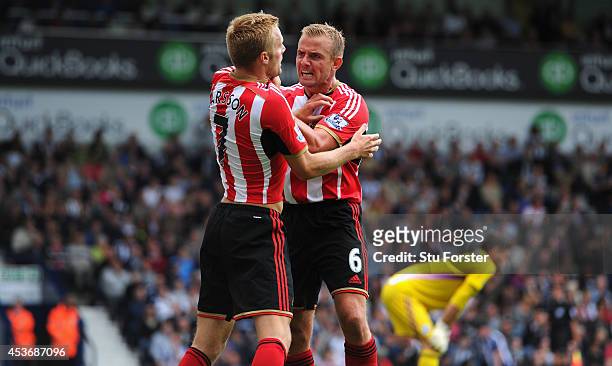 Sunderland player Lee Cattermole congratulates Seb Larsson after Larsson had score the second goal during the Barclays Premier League match between...